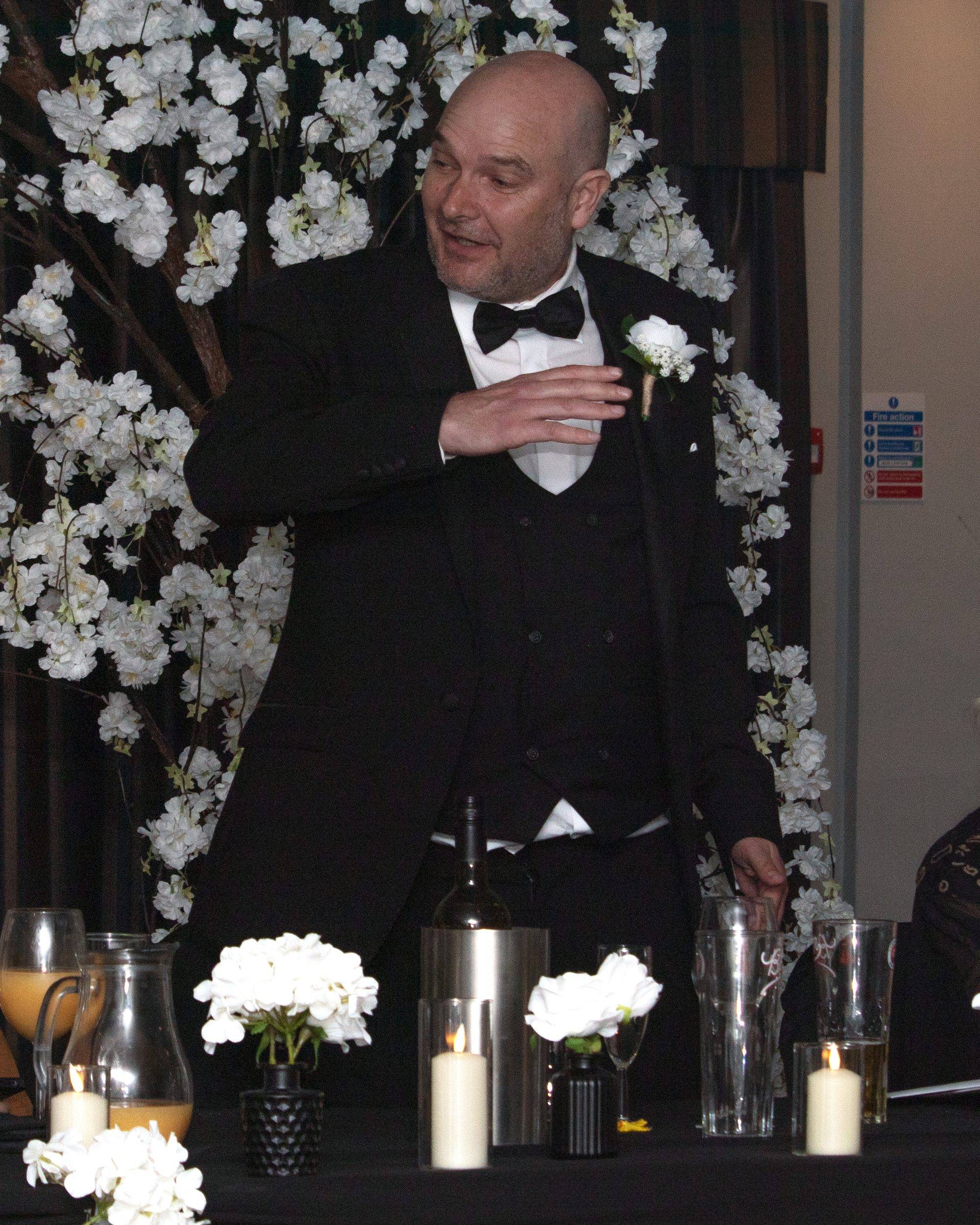 The father of the bride reading his speech