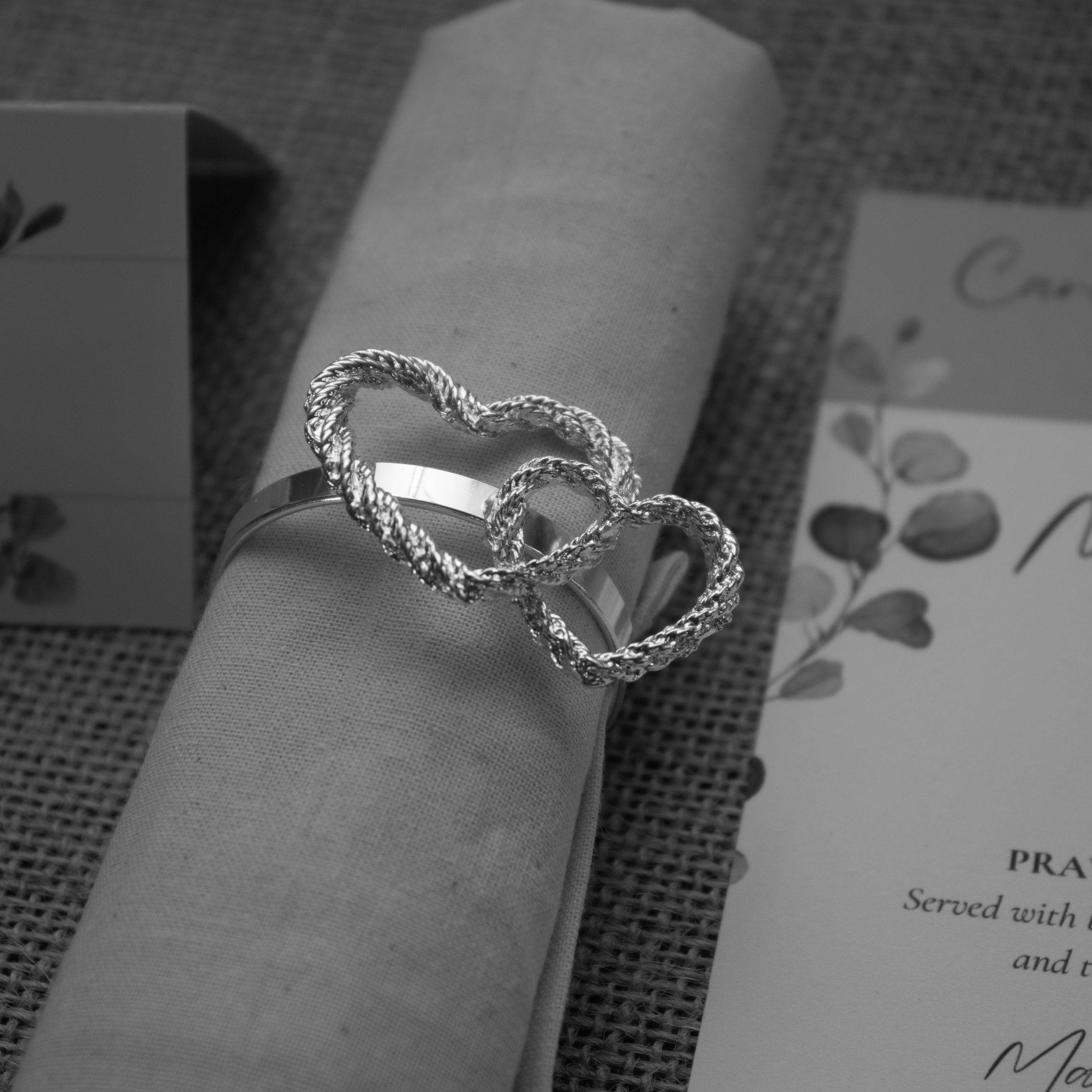 Black and white photograph of the rings on the table setting