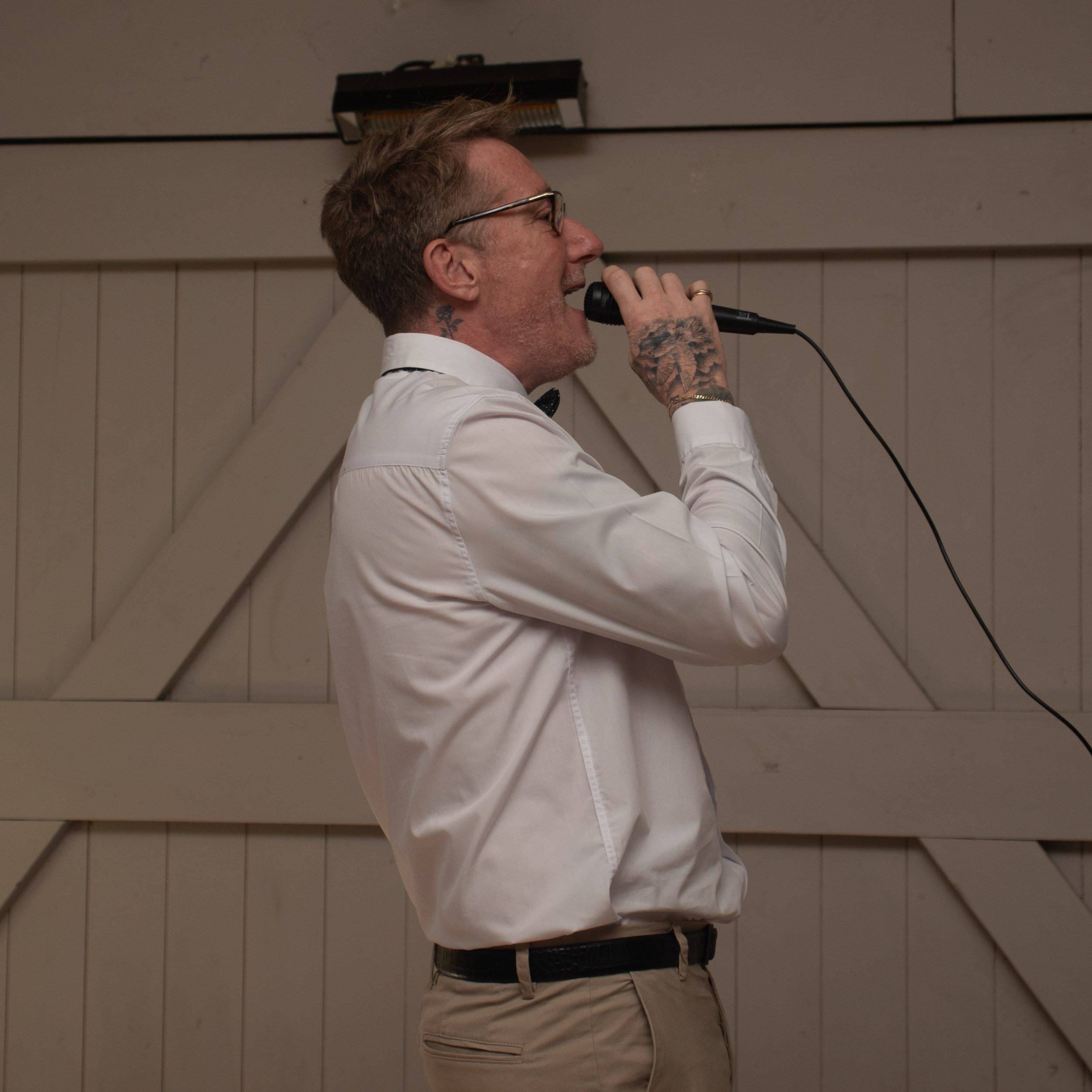A guest singing karaoke in the evening
