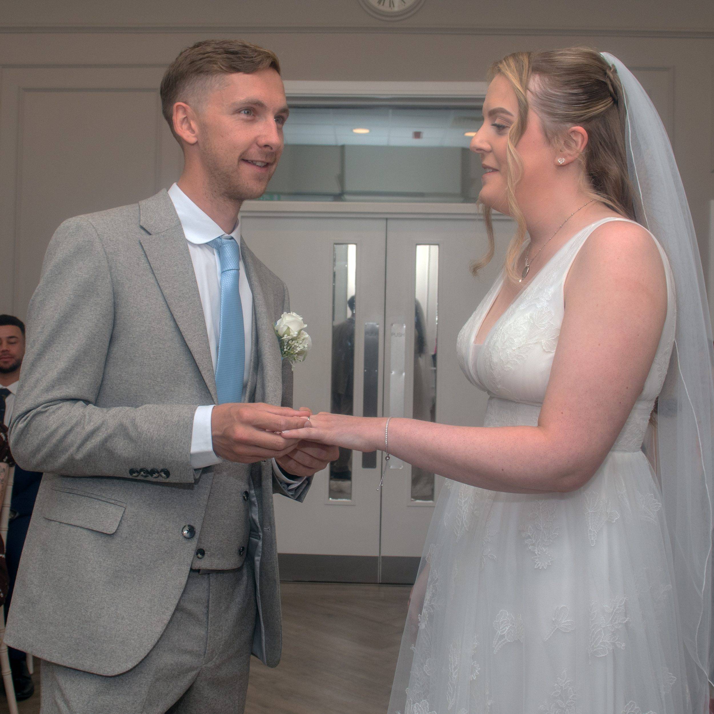 Exchanging rings during the ceremony