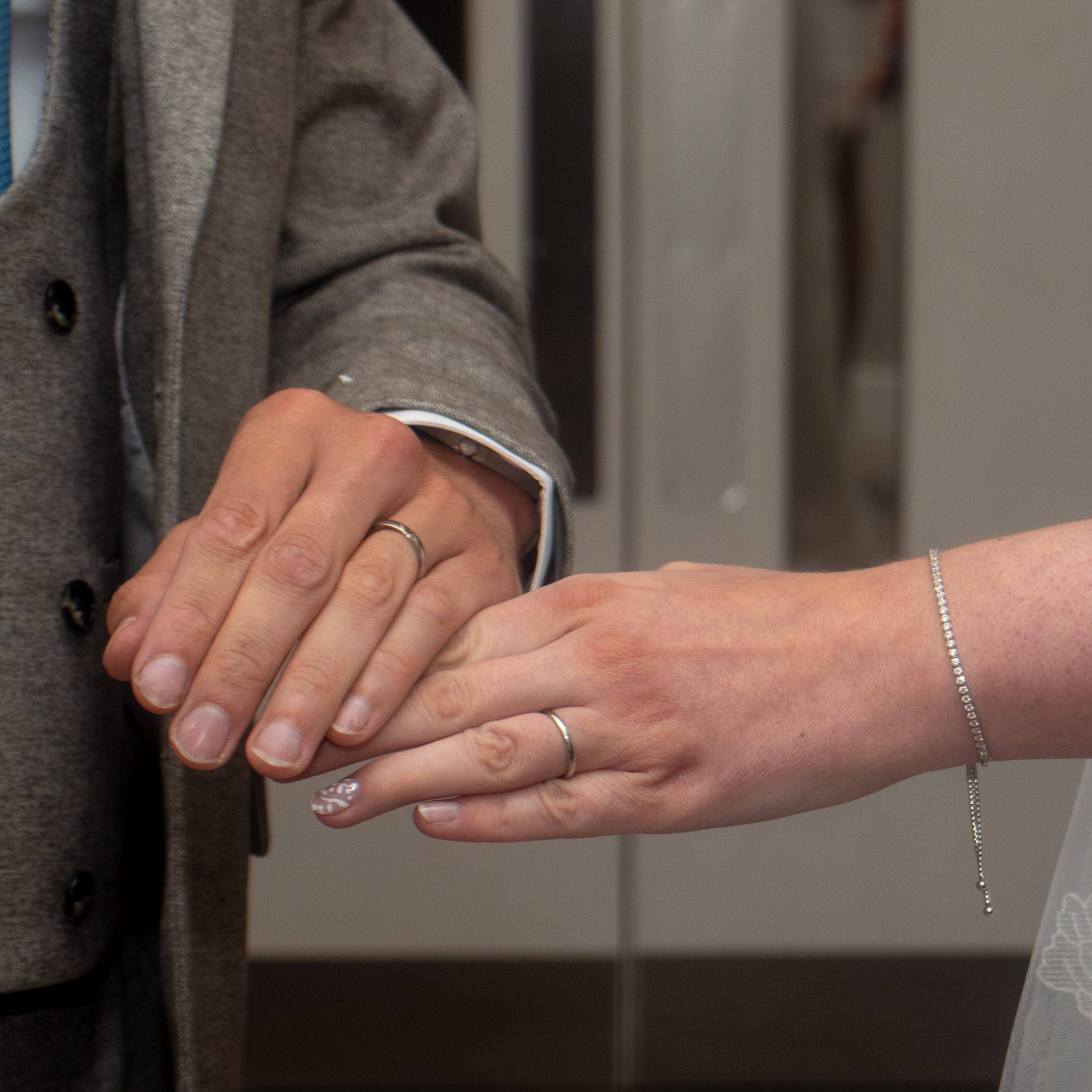 Close up of both wedding rings after the ceremony