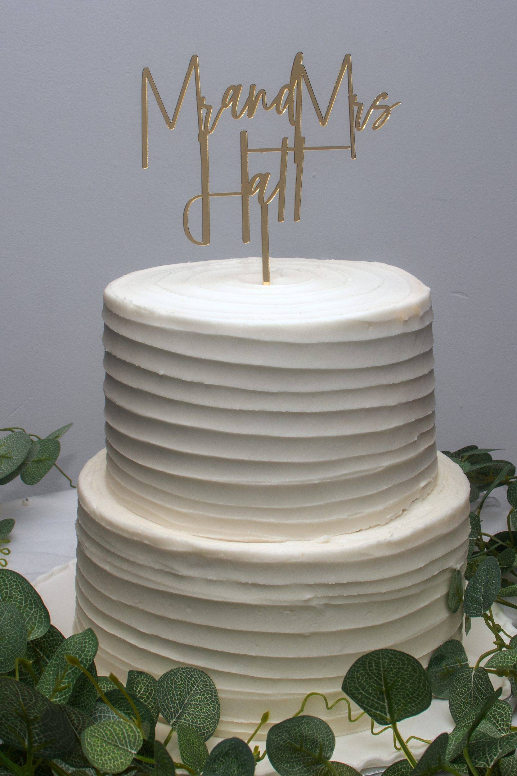 The wedding cake with a Mr and Mrs topper