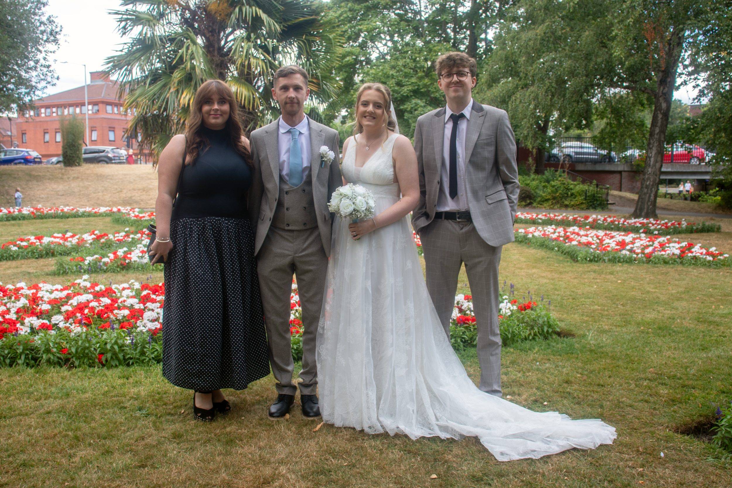 Luke and Alex in the gardens after their ceremony