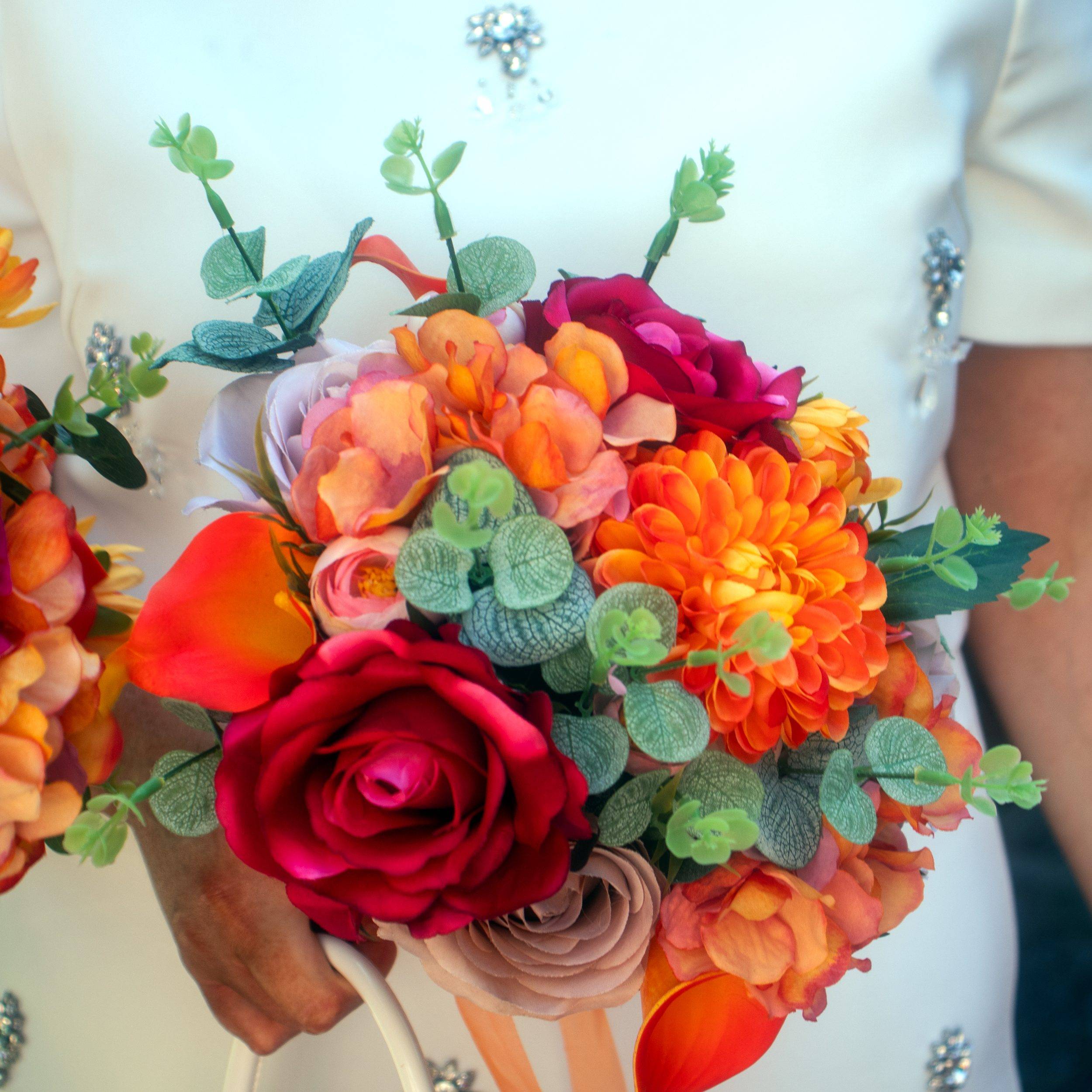 The bridal bouquet in bright orange and red